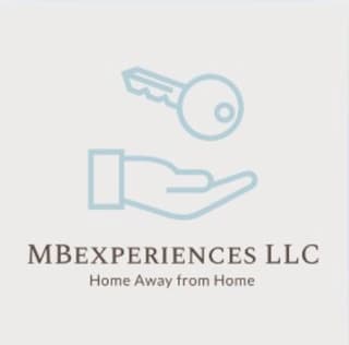 MB Experiences LLC, a key resting above an open hand
